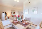 The dining table off the kitchen comfortably seats four